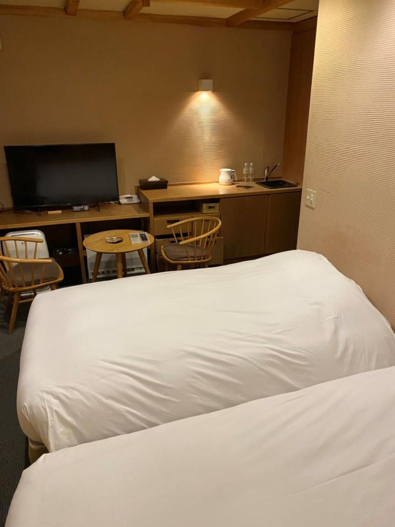 Miyama Ouan Kyoritsu Resort Takajama Kültér fotó A room at the hotel